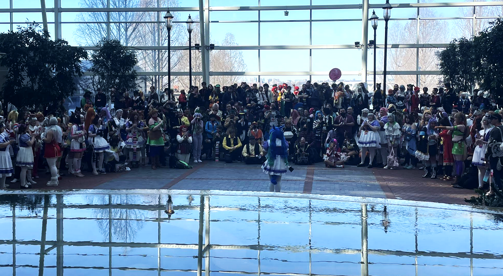 Hundreds of cosplayers gather around the Gaylord reflecting pool for a group meetup